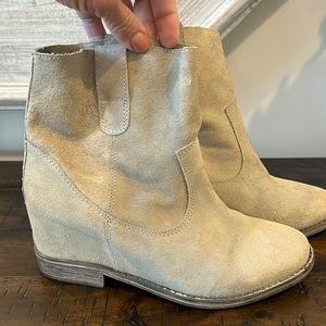 Tan suede hidden wedge booties.